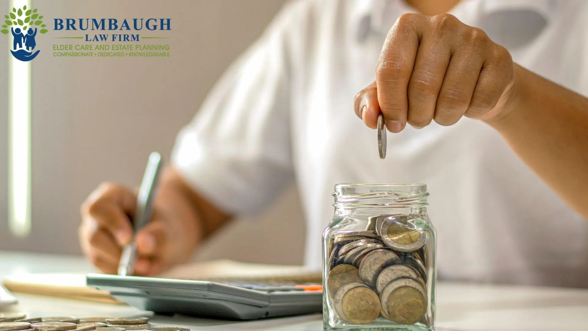Person saving coins in a glass jar